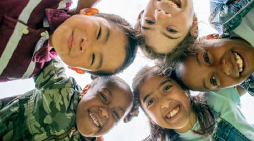 huddle of smiling children